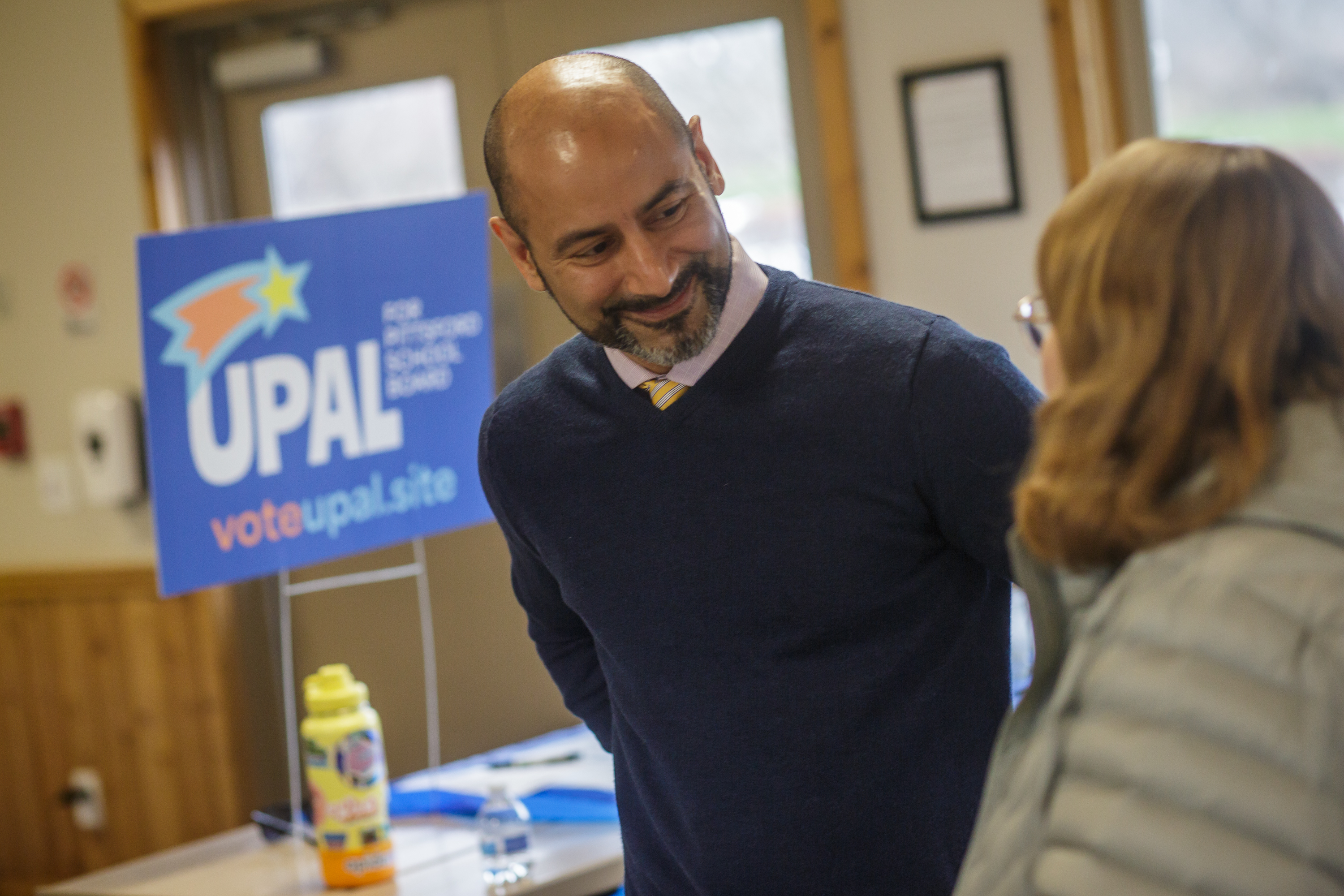 Anwar connecting with a Pittsford neighbor